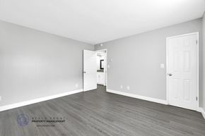 Inglewood apartment for rent - a bedroom with hardwood floors and grey walls