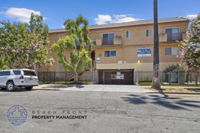 Van Nuys apartment for rent - a building with a car parked in front of it