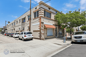Long Beach apartment for rent - A street view of a building with a sign that reads "BEACH FRONT PROPERTY MANAGEMENT".