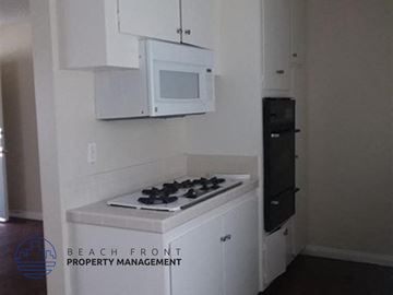 Inglewood apartment for rent - a small kitchen with a stove and a microwave