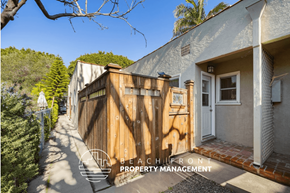 Santa Monica apartment for rent - a wooden gate and fence in front of a house