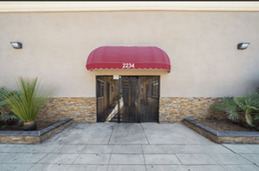Long Beach apartment for rent - A building with a red awning and the number 2234 on it.