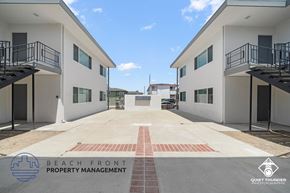 Torrance apartment for rent - an empty parking lot in front of a building