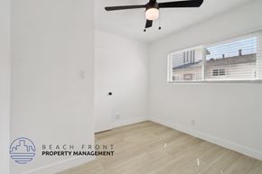 Buena Park apartment for rent - A room with a ceiling fan and a window with blinds.