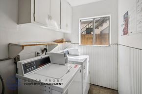 San Pedro apartment for rent - A machine shop with a CNC machine and a window showing a staircase.