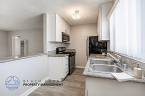 Long Beach apartment for rent - A kitchen with a sink, stove, and cabinets.