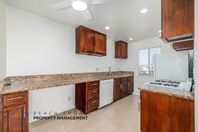 Long Beach apartment for rent - A kitchen with a counter top and cabinets.