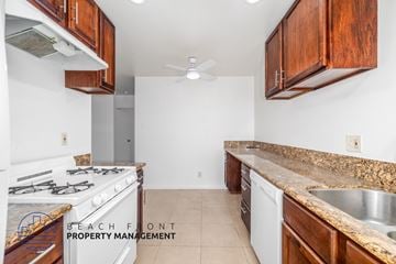 Long Beach apartment for rent - A kitchen with a stove top oven and a sink.