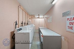 Los Angeles apartment for rent - a laundry room with several washes and dryers in it
