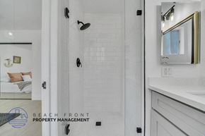 Valley Village apartment for rent - a white bathroom with a shower and a sink
