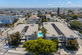 Redondo Beach apartment for rent - A bird's eye view of a city with buildings, roads, and a pool.