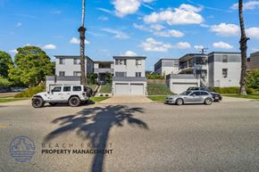 Santa Monica apartment for rent - an image of an apartment building with cars parked in front of it