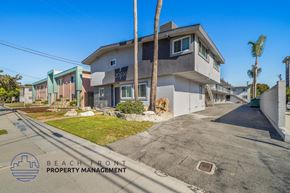 Torrance apartment for rent - a home with a street and palm trees in front of it