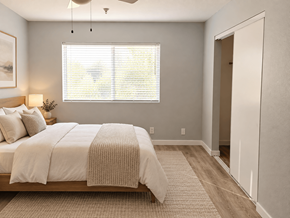 Hawthorne apartment for rent - A bedroom with a large bed and a window with blinds.