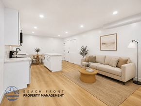Long Beach apartment for rent - A living room with a couch, a coffee table, and a plant.