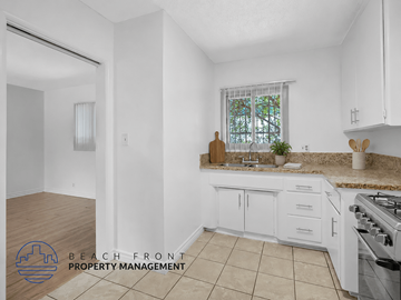 Los Angeles apartment for rent - A kitchen with white cabinets and a tiled floor.