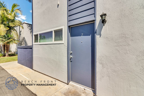 Costa Mesa apartment for rent - A blue door is on the right side of a white wall.