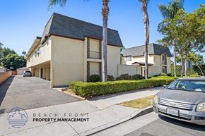 Anaheim apartment for rent - a beige house with a car parked in front of it