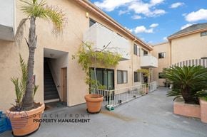 Los Angeles apartment for rent - a building with a patio and a palm tree outside of it