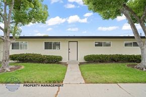 Anaheim apartment for rent - A building with a tree in front of it.