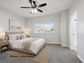 Costa Mesa apartment for rent - A bedroom with a large bed and a ceiling fan.