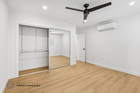 Long Beach apartment for rent - A room with a ceiling fan and a sliding door.