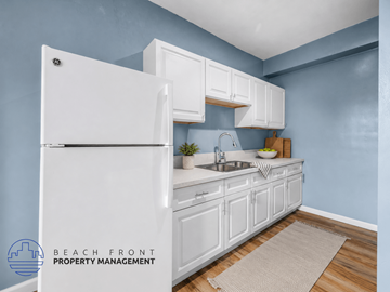 Los Angeles apartment for rent - A kitchen with white cabinets and a white refrigerator.