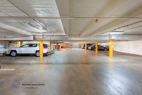 Los Angeles apartment for rent - a parking garage with cars parked in it