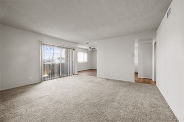 Inglewood apartment for rent - A sparsely furnished living room with a view of a balcony.