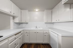 Inglewood apartment for rent - A kitchen with white cabinets and a white countertop.