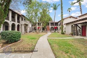 Riverside apartment for rent - A row of houses with a sign that says Beachfront Property Management.