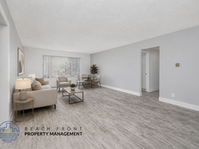 Long Beach apartment for rent - A living room with a couch, chairs, and a coffee table.