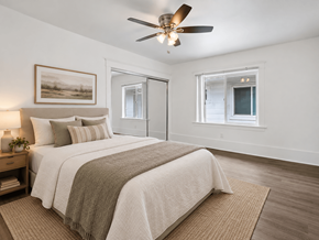 Long Beach apartment for rent - A bedroom with a large bed and a ceiling fan.