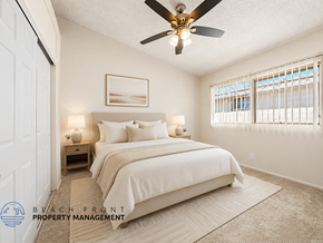 Gardena apartment for rent - A bedroom with a large bed and a ceiling fan.