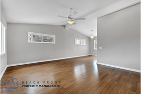 Costa Mesa apartment for rent - the living room and dining room with hardwood flooring and a ceiling fan