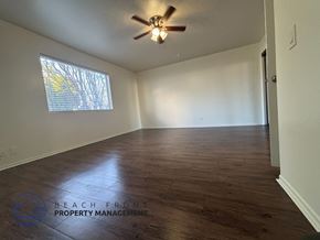 Hawthorne apartment for rent - A room with wooden flooring and a ceiling fan.
