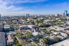 Long Beach apartment for rent - A cityscape with a mix of residential and commercial buildings under a clear sky.