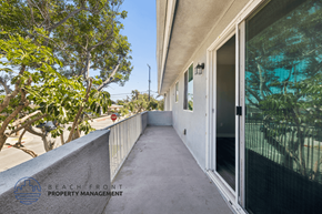 Hawthorne apartment for rent - A balcony with a view of trees and a clear sky.
