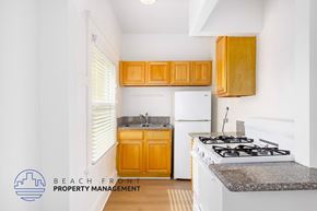 Los Angeles apartment for rent - A kitchen with a stove, sink, and cabinets.