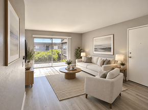 Redondo Beach apartment for rent - A modern living room with a large window and a view of the outdoors.