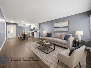 Santa Ana apartment for rent - A living room with a couch, chairs, and a coffee table.