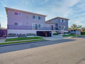 Lawndale apartment for rent - A modern two-story building with a balcony and a garage door.