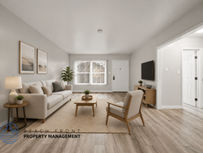 Long Beach apartment for rent - A living room with a couch, chair, and a television.