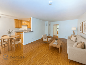 Los Angeles apartment for rent - A living room with a couch, chairs, and a dining table.