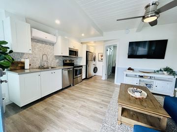 Hermosa Beach apartment for rent - a kitchen and living room with a tv and a table
