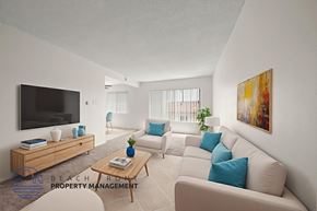 Inglewood apartment for rent - A living room with a television, sofas, and a coffee table.