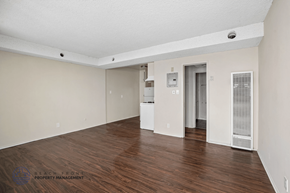 Lennox apartment for rent - A spacious room with wooden floors and white walls.