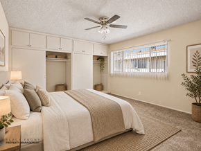 Gardena apartment for rent - A bedroom with a large bed and a ceiling fan.