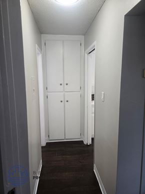 Norwalk apartment for rent - A hallway with a white door and a white cabinet.
