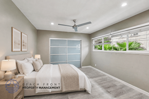 Los Angeles apartment for rent - A well-lit bedroom with a large bed and a ceiling fan.